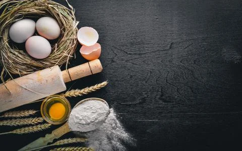 Preparation for baking. Eggs with a rolling pin. On the stone table. Free spa Stock Photos