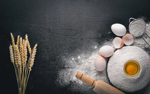 Preparation for baking. Eggs with a rolling pin. On the stone table. Free spa Stock Photos