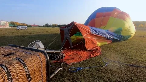 Preparation for a balloon flight. The pilot inflates the balloon with hot air Stock Footage 207517827