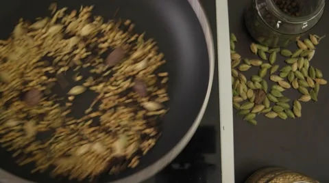 Preparation of basic Indian cooking with dry raw spices Stock Footage 62824214