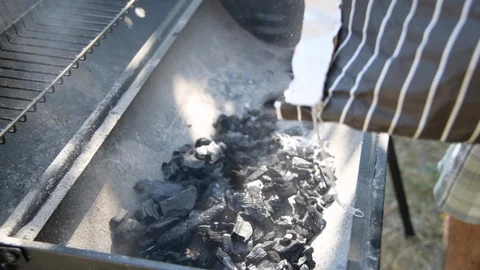 Preparation bbq with carbonella Stock Footage 93389019