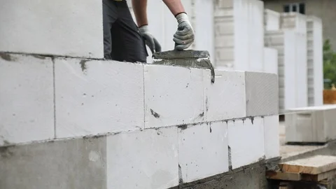Preparation of cement layer of the aerated concrete blocks wall Stock-Footage 103126897