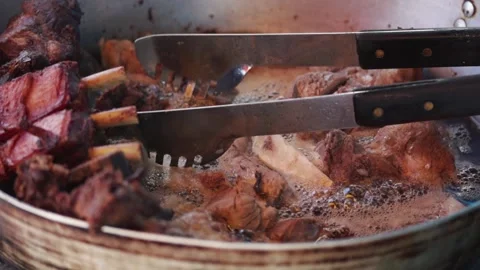 Preparation of chicharron, typical Peruvian food. Food concept and traditions. Stock Footage 229570827