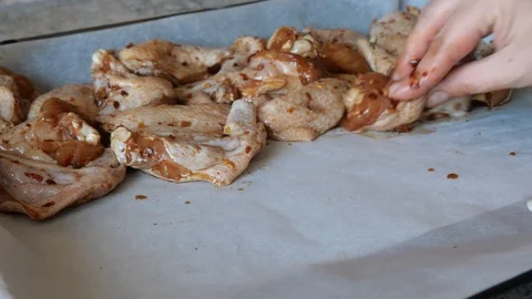 Preparation chicken wings for baking in the oven. Stock Footage 117281908