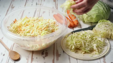 Preparation of chopped cabbage for fermentation Stock Footage 144846538