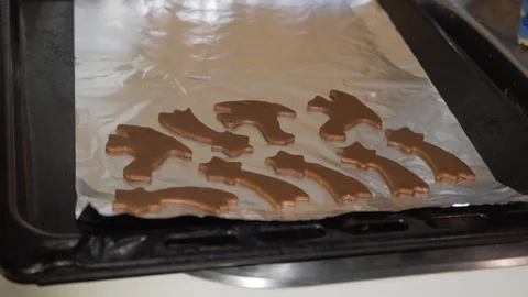 Preparation christmas cookies like comet on baking sheet Stock Footage 128507484