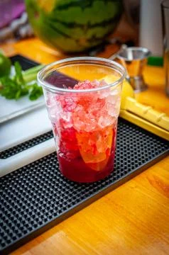 Preparation of cocktail. Adding ice, shaking ingredients and decorating with  Stock Photos