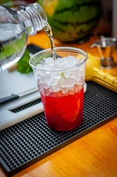 Preparation of cocktail. Adding ice, shaking ingredients and decorating with  Stock Photos