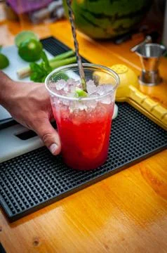 Preparation of cocktail. Adding ice, shaking ingredients and decorating with  Stock Photos