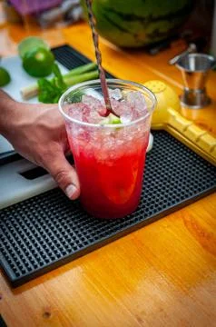 Preparation of cocktail. Adding ice, shaking ingredients and decorating with  Stock Photos