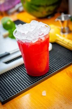 Preparation of cocktail. Adding ice, shaking ingredients and decorating with  Stock Photos