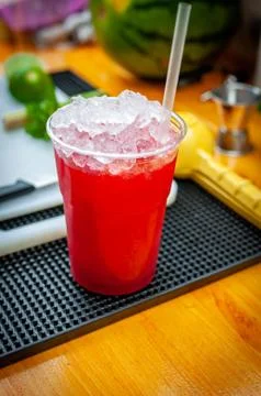 Preparation of cocktail. Adding ice, shaking ingredients and decorating with  Stock Photos