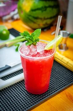 Preparation of cocktail. Adding ice, shaking ingredients and decorating with  Stock Photos