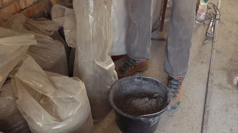 Preparation of concrete mortar by hand	 Stock Footage 104773033