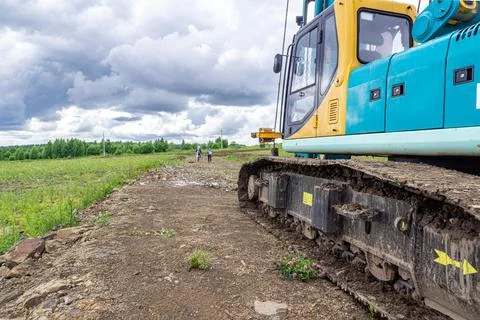Preparation for construction work, crawler construction equipment stands on a Stock Photos