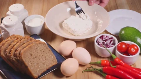 Preparation of cottage cheese for breakfast. Stock Footage 145376437