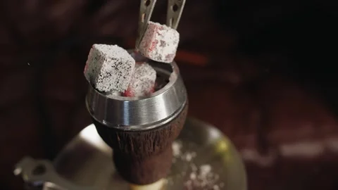Preparation in cozy lounge and setting heat for shisha session in a hookah bar 스톡 동영상 331883385