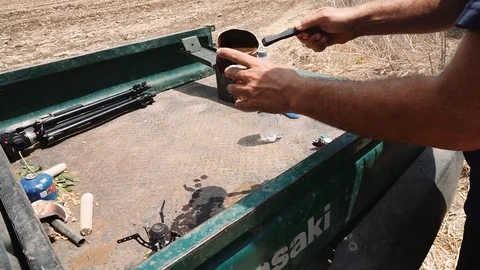Preparation of a cup of coffee in the middle of field work, Summer in Israel Stock Footage 93594940