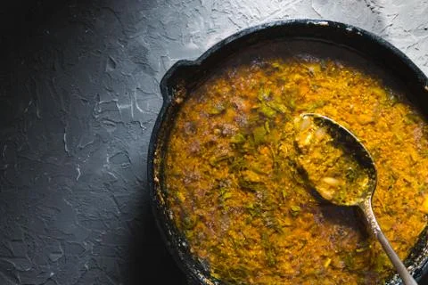 Preparation of curry paste in a cast-iron frying pan. Indian food Stock Photos