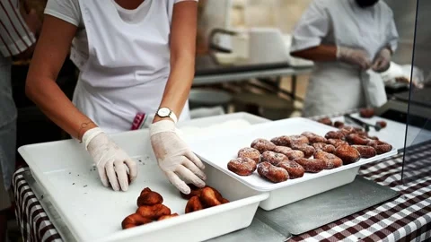 Preparation of delicious sugar donuts Stock Footage 168416717
