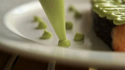 Preparation of dishes. The chef prepares a dish on a plate. Stock Footage 113223699