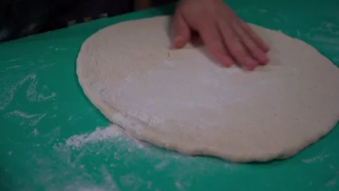 Preparation of Dough Adding the Final Touch with Flour Stock Footage 293257498