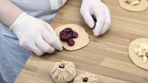 Preparation dough for baking small cakes with cherries Stock Footage 70004212