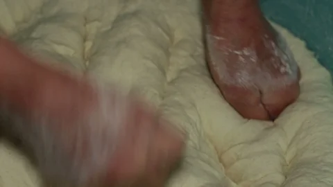Preparation of the dough of the bread with ancient method using your hands. Video stock 129539944