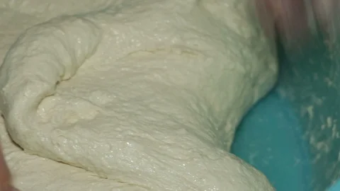 Preparation of the dough of the bread with ancient method using your hands. Stock-Footage 129539987