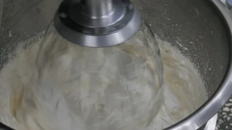 Preparation of dough, cream in production using a professional kneader. Stock Footage 142243284