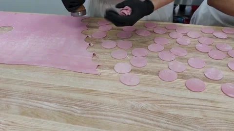 Preparation of the Dough for Making Dumplings. Pink Dough for Sweet Dumplings Stock Footage 252996774