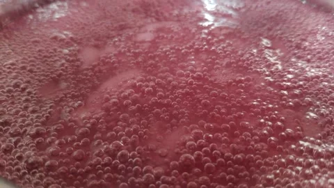 Preparation of the drink. The drink is boiling in a pot in the kitchen. Stock Footage 307211475