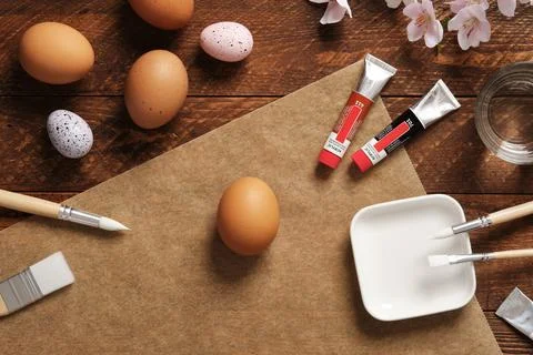 Preparation for Easter celebration. Painting Easter eggs with acrylic pigment Stock Photos