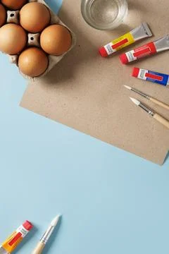 Preparation for Easter celebration. Painting Easter eggs with acrylic pigment Stock Photos