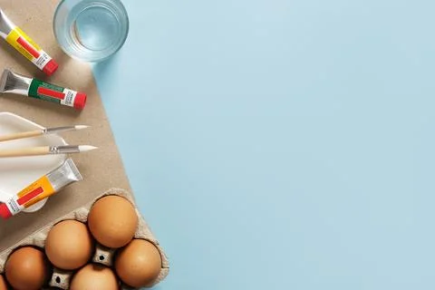 Preparation for Easter celebration. Painting Easter eggs with acrylic pigment Stock Photos