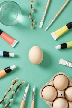 Preparation for Easter celebration. Painting Easter eggs with acrylic pigme.. Stock Photos