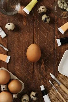 Preparation for Easter celebration. Painting Easter eggs with acrylic pigment Stock Photos