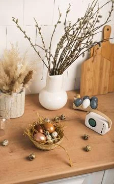 Preparation for Easter. painted Easter eggs in kitchen on wooden countertop Stock Photos