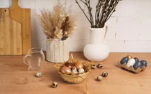 Preparation for Easter. painted Easter eggs in kitchen on wooden countertop Stock Photos