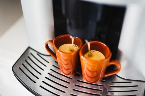 Preparation of espresso in an automatic coffee machine Stock Photos