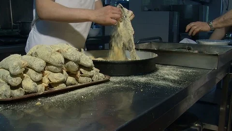 Preparation of fish for frying. Enveloping with spices and breadcrumbs  Stock Footage 90684871