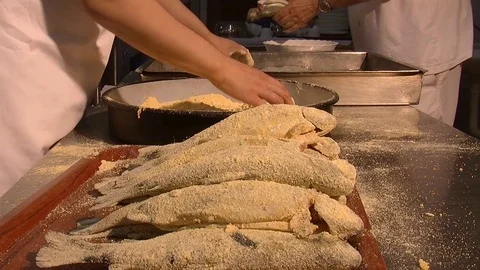 Preparation of fish for frying. Enveloping with spices and breadcrumbs  Stock Footage 90685142