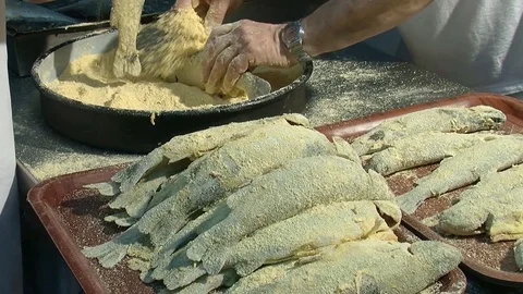 Preparation of fish for frying. Enveloping with spices and breadcrumbs  動画素材 90685404