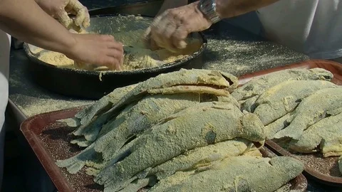 Preparation of fish for frying. Enveloping with spices and breadcrumbs  Stock Footage 90685584