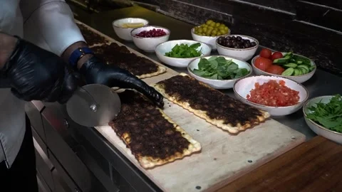 Preparation of Flatbread with Meat Topping Stock Footage 319950606