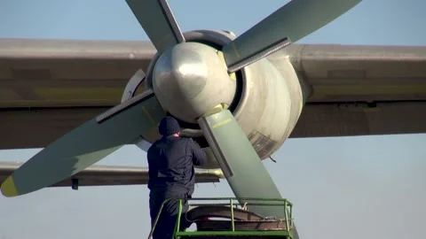 Preparation for flight of An-12BK aircraft. Propeller close-up. NATO - Cub. Stock Footage 170883618