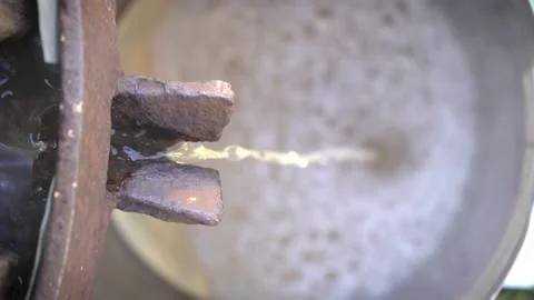 Preparation of fresh apple juice with an old fruit press. Close up squeezing of Stock Footage 167701706
