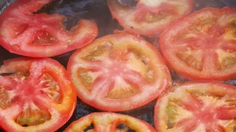 Preparation of the fried tomatoes in UHD Stock Footage 115013483