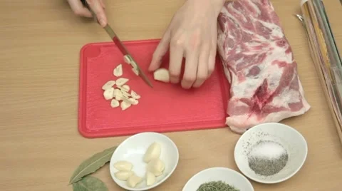 Preparation of garlic for marinating meat Stock Footage 7740893