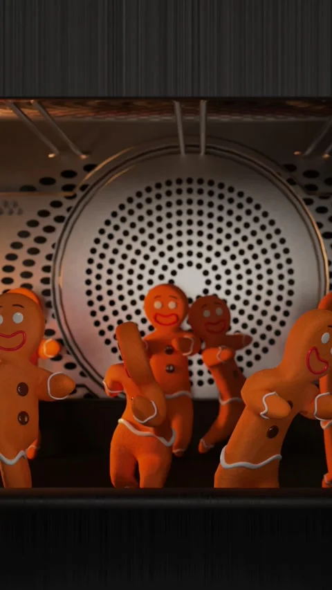 Preparation of gingerbread men in the oven while they, in the meantime, dance. Stock Footage 255822186